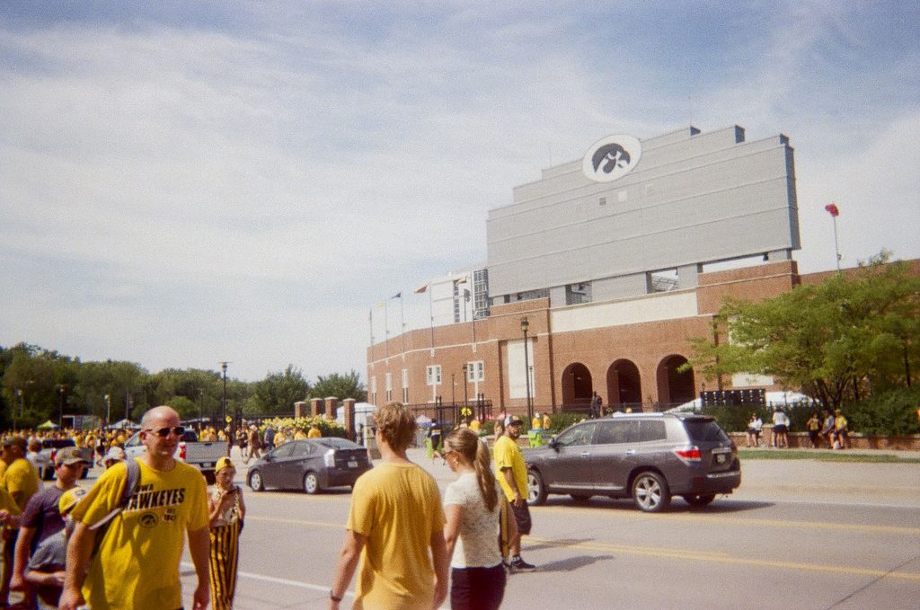 People walking in Kinnick stadium.